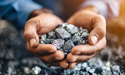 Image of a person holding minerals