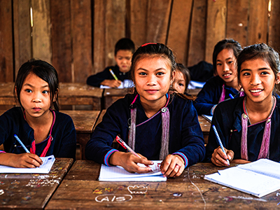 Image of three children at a school